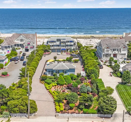 a view of a swimming pool with potted plants