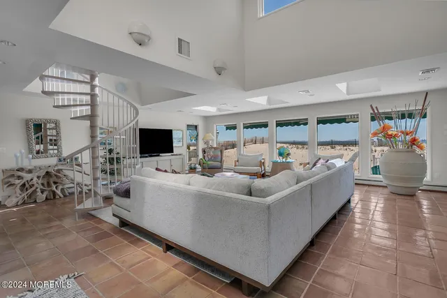 a bedroom with a bed and a television