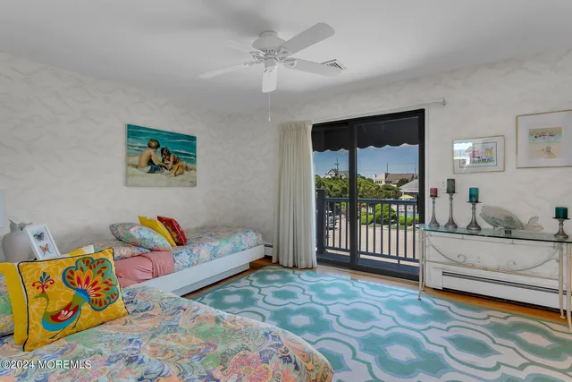 a view of a livingroom with furniture and staircase