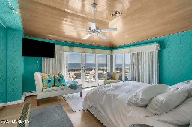 a bedroom with a couch and a rug