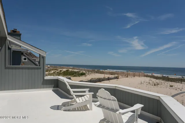 a bed sitting in a bedroom next to a balcony