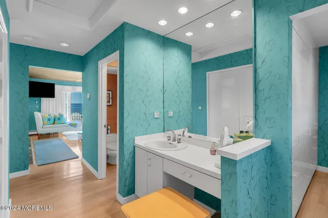 a aerial view of a house with swimming pool lawn chairs and a yard