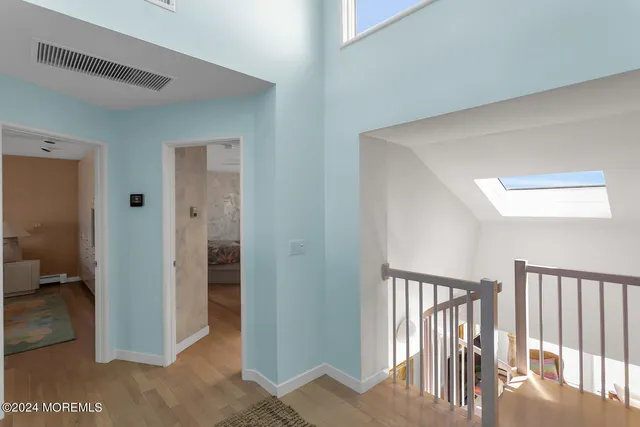 a kitchen with a sink cabinets stainless steel appliances and a window