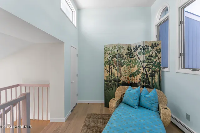 a kitchen with granite countertop a stove a sink and a refrigerator