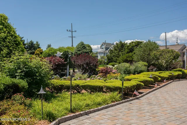 a view of a house with swimming pool and sitting area