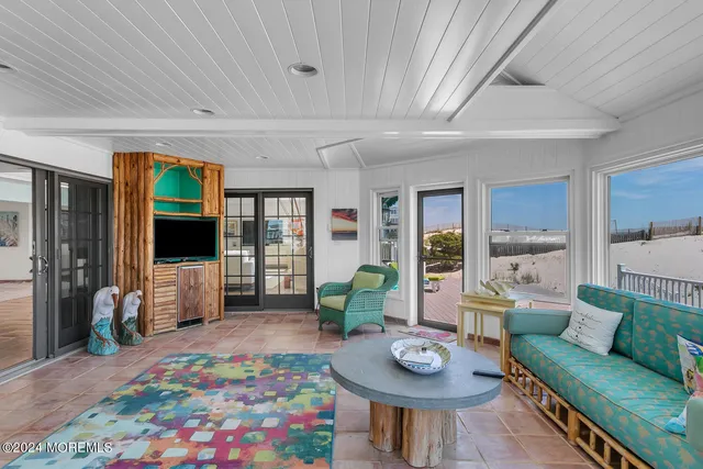 a view of a house with a yard and sitting area