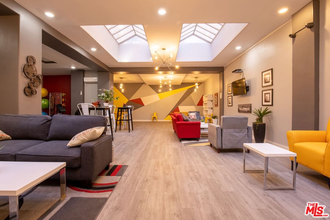 729 South Union Avenue, Unit 207 Los Angeles, CA 90017 - Photo 11 of 19 a living room with furniture and wooden floor