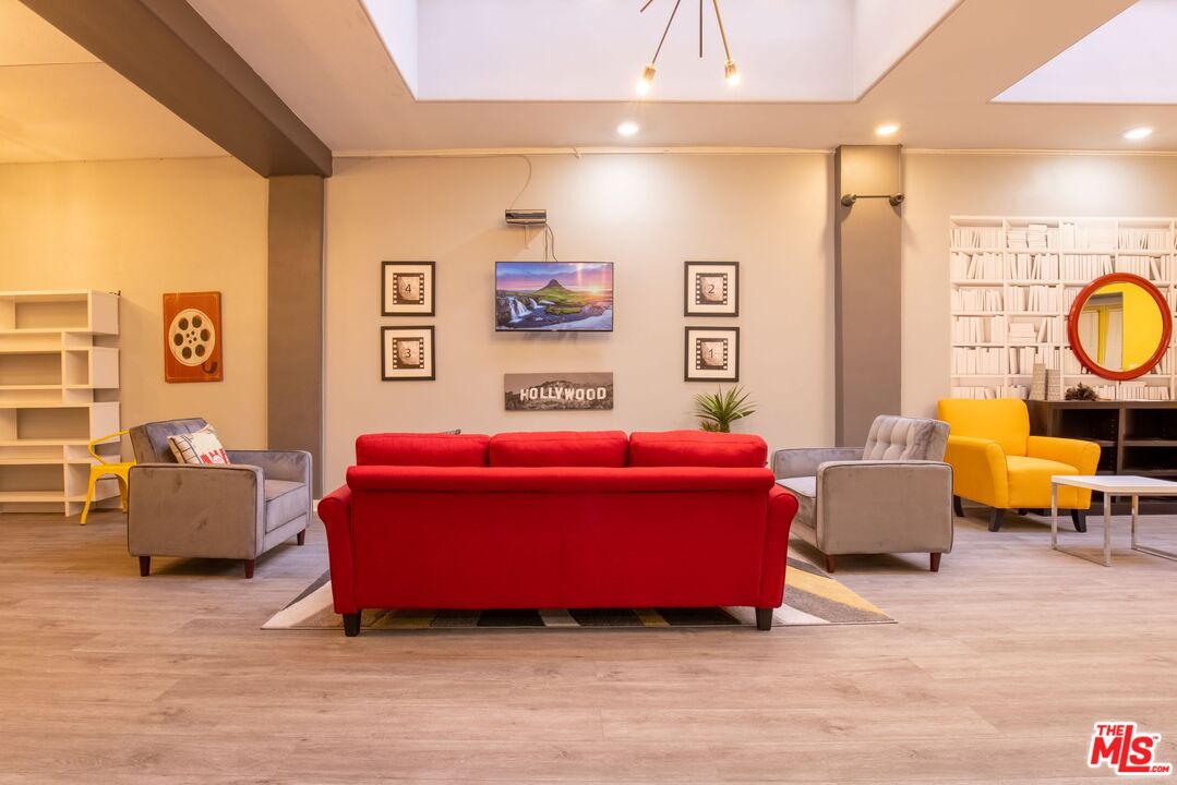 729 South Union Avenue, Unit 207 Los Angeles, CA 90017 - Photo 14 of 19 a bedroom with furniture and a large window