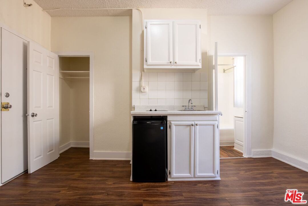 729 South Union Avenue, Unit 207 Los Angeles, CA 90017 - Photo 3 of 19 a kitchen with stainless steel appliances granite countertop a refrigerator and cabinets