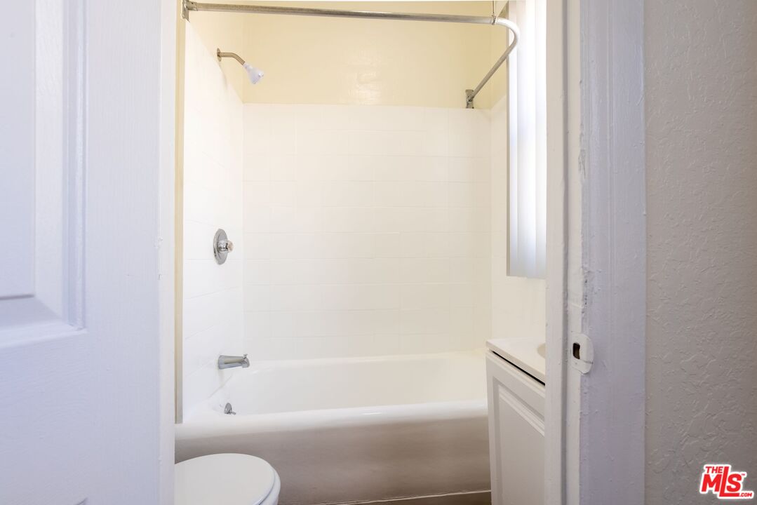 729 South Union Avenue, Unit 207 Los Angeles, CA 90017 - Photo 5 of 19 a bathroom with a vanity and a shower