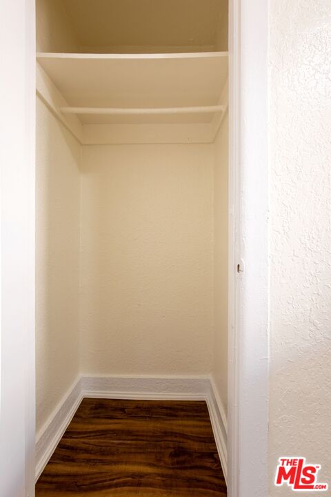729 South Union Avenue, Unit 207 Los Angeles, CA 90017 - Photo 9 of 19 a view of room with walk in closet and wooden floor