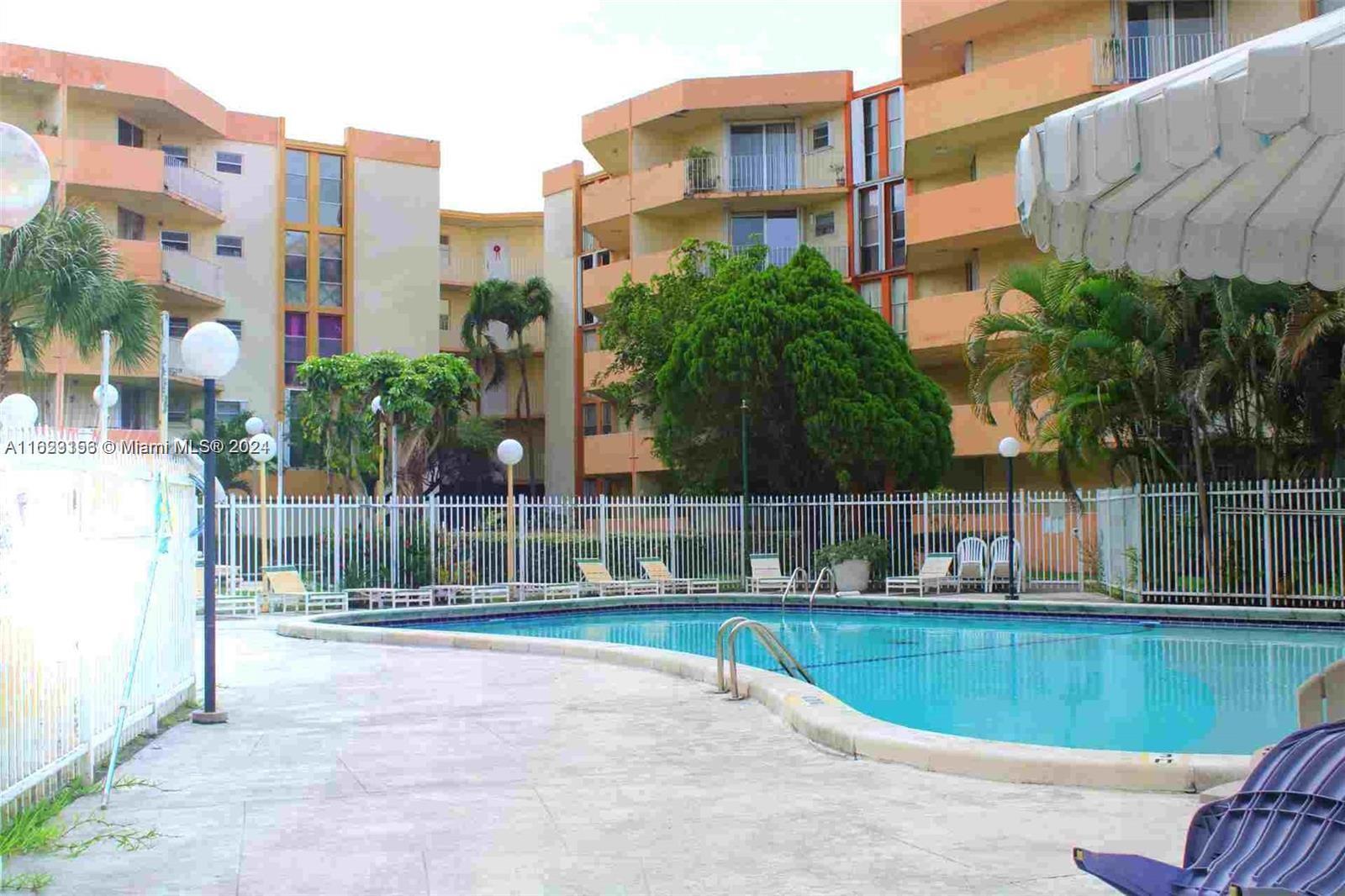1750 West 46th Street, Unit 433 Hialeah, FL 33012 - Photo 11 of 14 a view of outdoor space with swimming pool