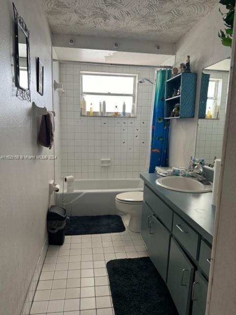1750 West 46th Street, Unit 433 Hialeah, FL 33012 - Photo 7 of 14 a bathroom with a sink a toilet and shower