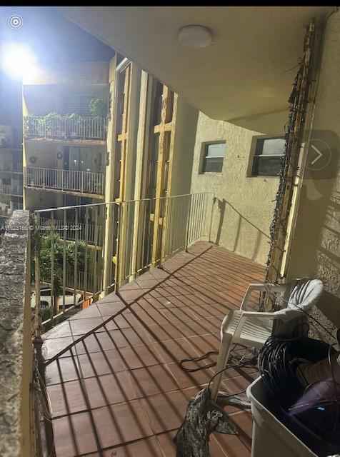 1750 West 46th Street, Unit 433 Hialeah, FL 33012 - Photo 8 of 14 view of balcony with wooden floor