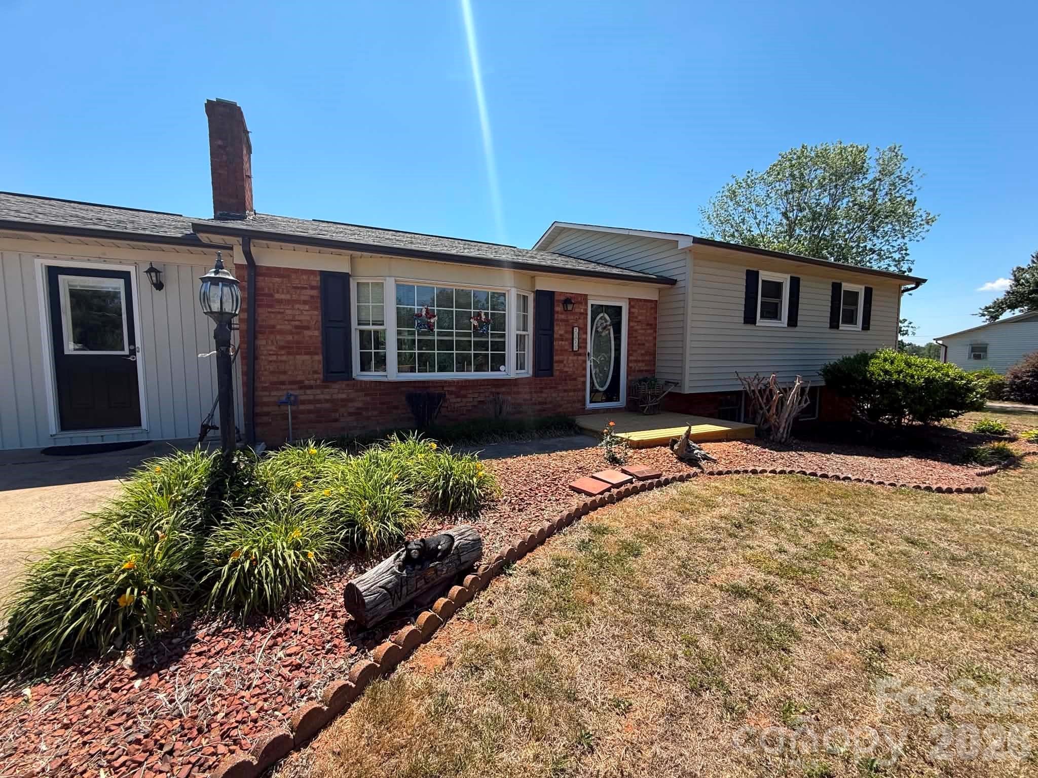 2121 Union Grove Road Lenoir, NC 28645 - Photo 1 of 38 a house view with a garden space