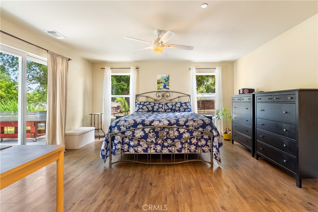 10825 Colorado Road Atascadero, CA 93422 - Photo 16 of 35 a bedroom with a bed and wooden floor