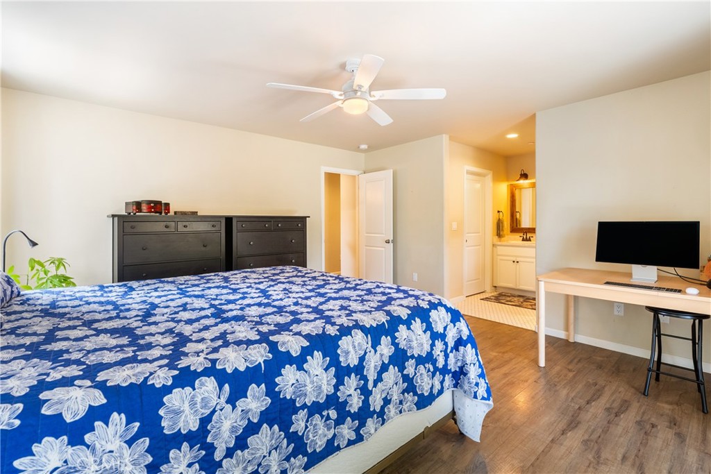 10825 Colorado Road Atascadero, CA 93422 - Photo 17 of 35 a bedroom with a bed and a flat screen tv