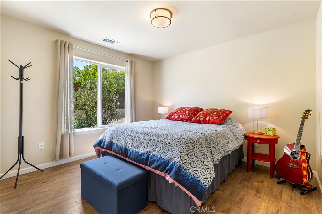 10825 Colorado Road Atascadero, CA 93422 - Photo 23 of 35 a bedroom with a bed and a window