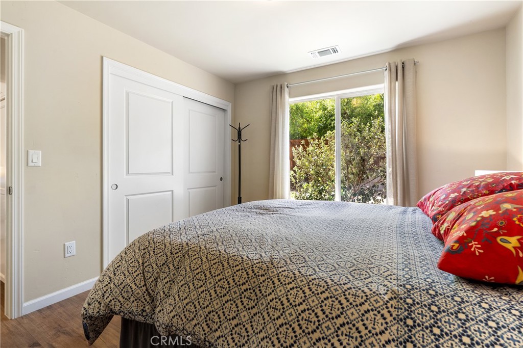 10825 Colorado Road Atascadero, CA 93422 - Photo 24 of 35 a bedroom with a bed and a window