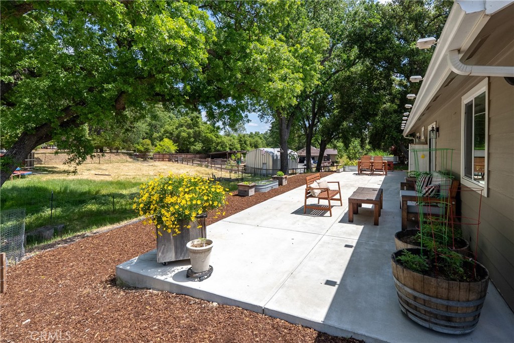 10825 Colorado Road Atascadero, CA 93422 - Photo 27 of 35 a view of a patio with table and chairs potted plants and swimming pool