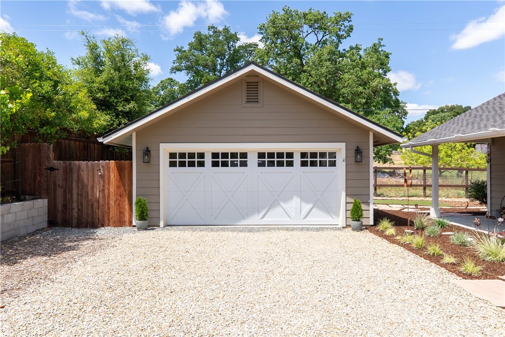 10825 Colorado Road Atascadero, CA 93422 - Photo 5 of 35 a front view of a house with a yard and garage