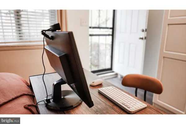 a view of workspace with lounge chair