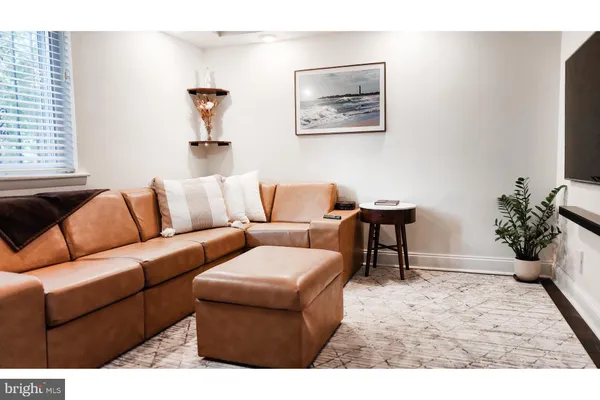 a living room with furniture and a couch