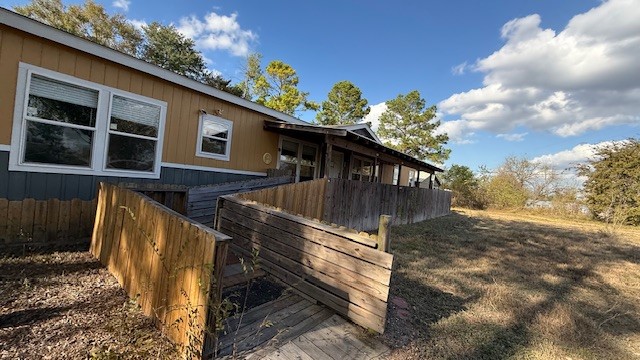 71 Trail Ridge Road Huntsville, TX 77320 - Photo 14 of 16 a view of a house with a yard
