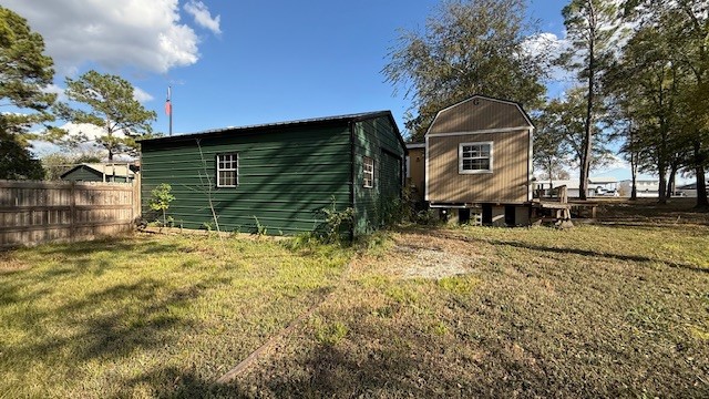 71 Trail Ridge Road Huntsville, TX 77320 - Photo 15 of 16 a front view of a house with a yard