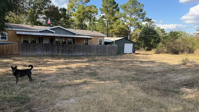 71 Trail Ridge Road Huntsville, TX 77320 - Photo 16 of 16 a front view of a house with a yard