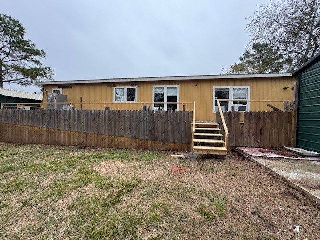 71 Trail Ridge Road Huntsville, TX 77320 - Photo 2 of 16 a view of a house with a backyard and wooden fence