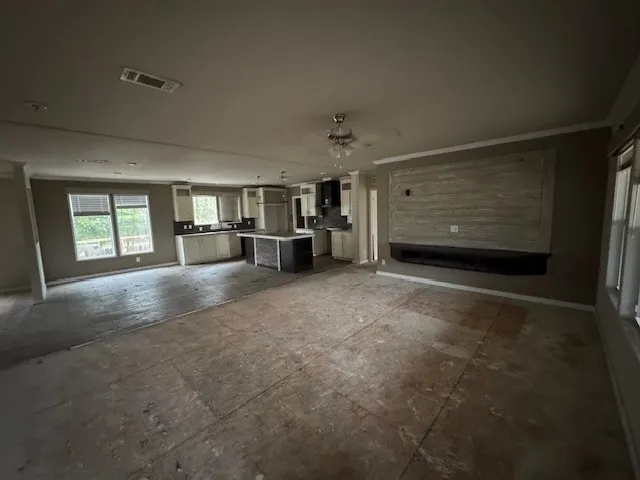a view of empty room with a fireplace