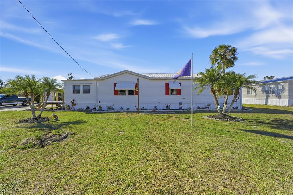 a view of a house with a big yard