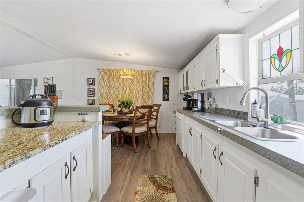 11269 Southwest Welch Avenue Arcadia, FL 34269 - Photo 13 of 41 a large kitchen with granite countertop lots of counter space and sink