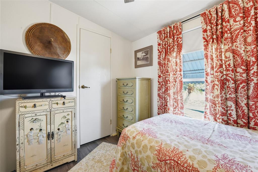 11269 Southwest Welch Avenue Arcadia, FL 34269 - Photo 16 of 41 a bedroom with a bed and a flat screen tv