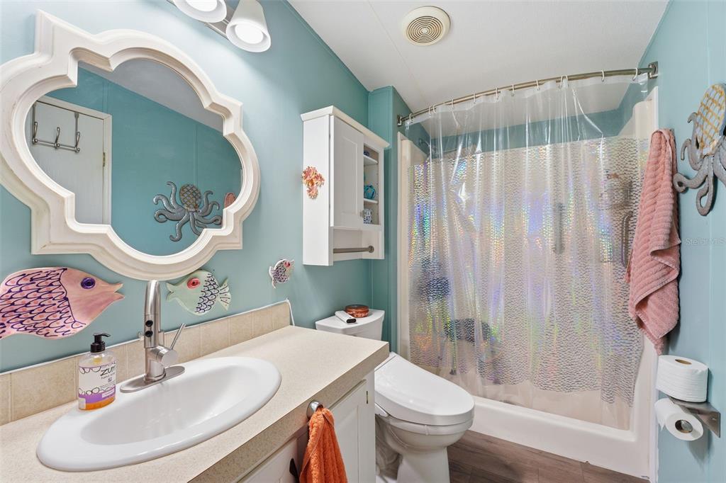 11269 Southwest Welch Avenue Arcadia, FL 34269 - Photo 17 of 41 a bathroom with a sink toilet and shower