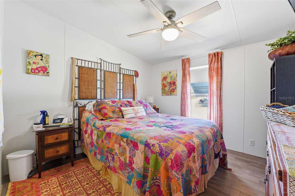 11269 Southwest Welch Avenue Arcadia, FL 34269 - Photo 18 of 41 a bedroom with a bed dresser and a flat tv screen