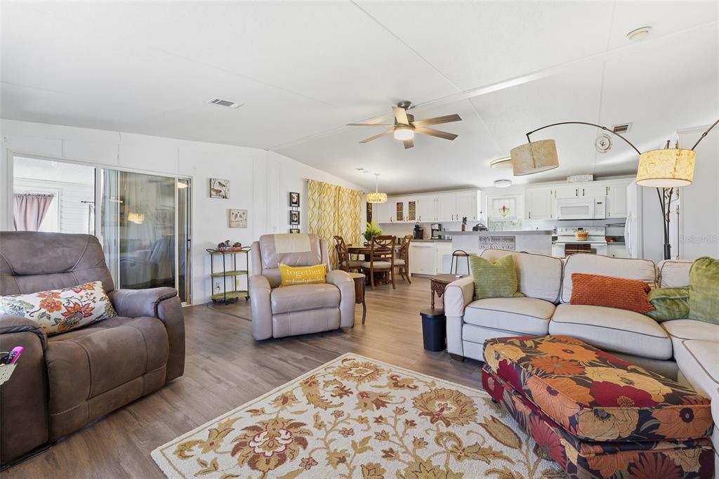 11269 Southwest Welch Avenue Arcadia, FL 34269 - Photo 5 of 41 a living room with furniture fireplace and a rug
