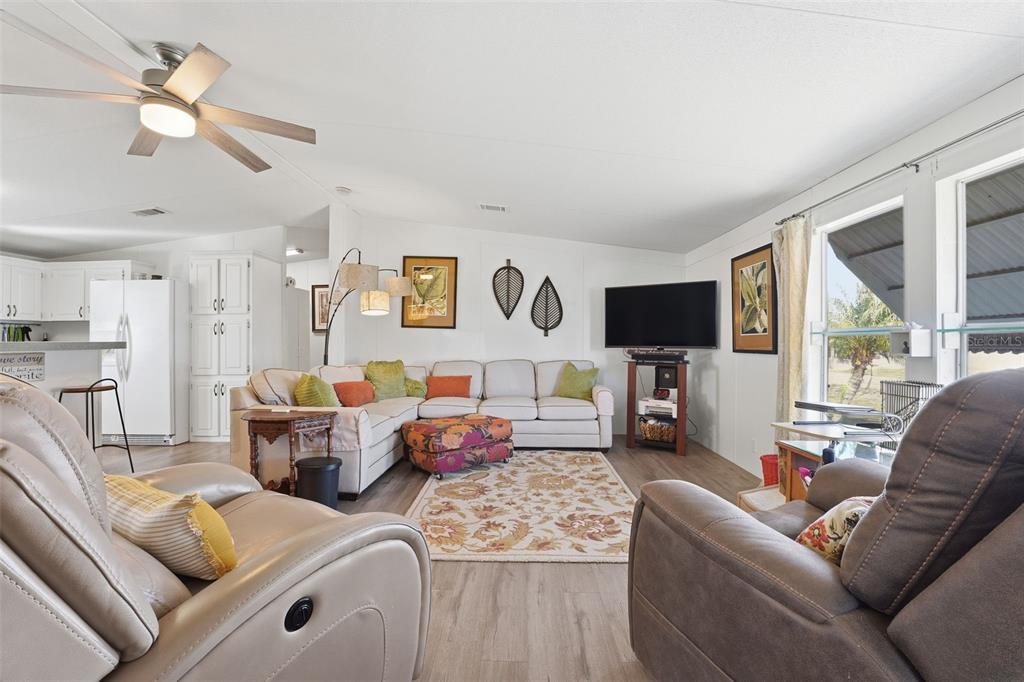 11269 Southwest Welch Avenue Arcadia, FL 34269 - Photo 6 of 41 a living room with furniture and a flat screen tv