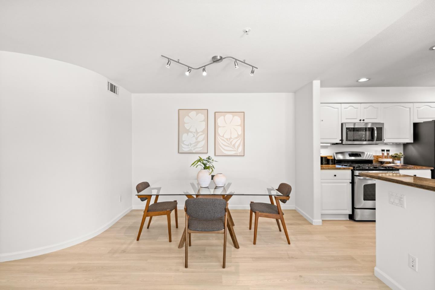 986 Alpine Terrace, Unit 4 Sunnyvale, CA 94086 - Photo 13 of 59 a view of a dining room with furniture and wooden floor