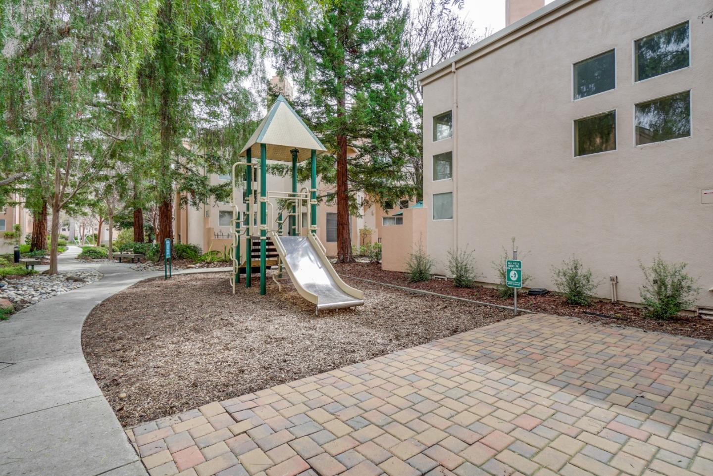 986 Alpine Terrace, Unit 4 Sunnyvale, CA 94086 - Photo 47 of 59 a front view of a house with a yard
