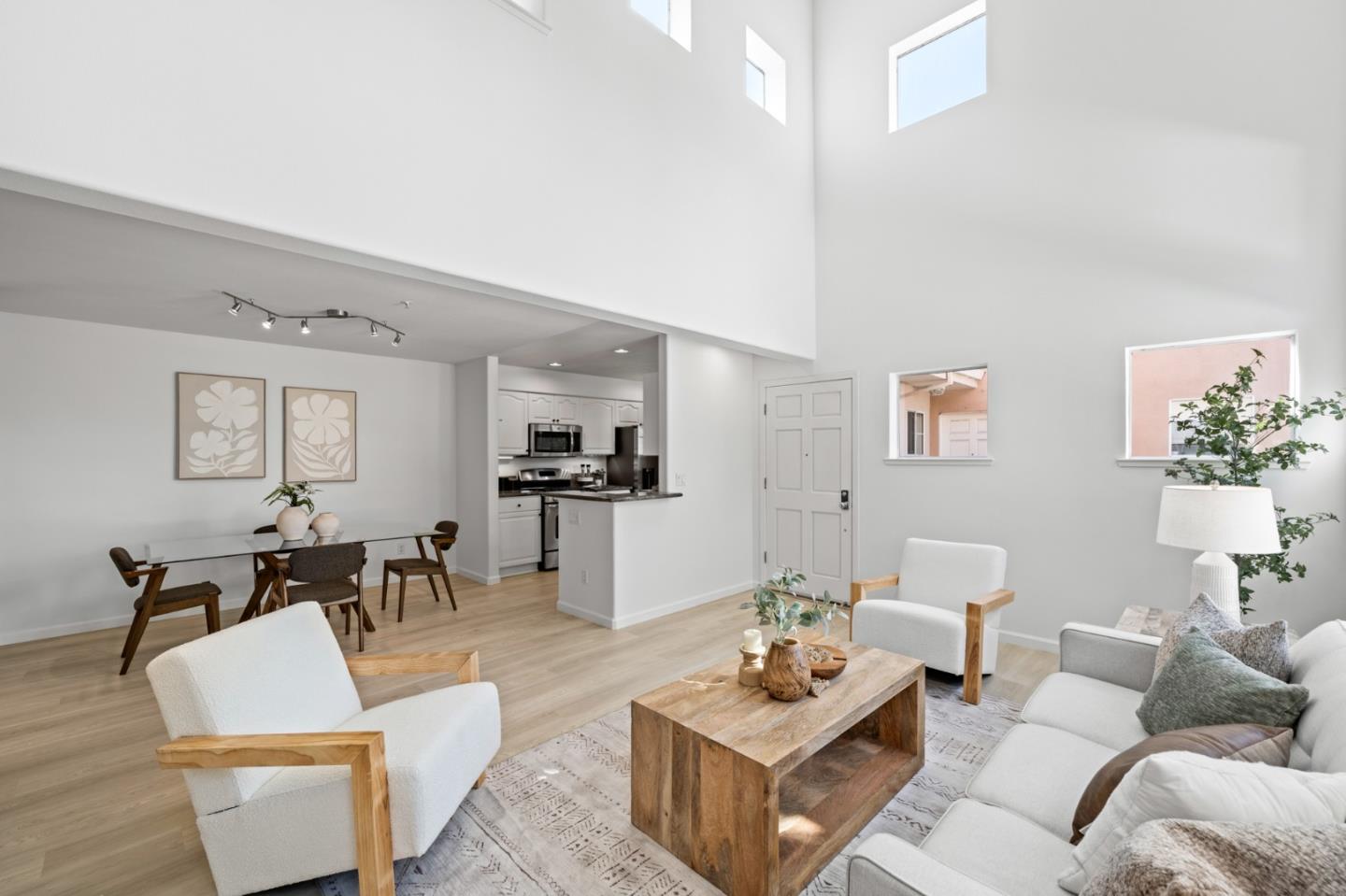 986 Alpine Terrace, Unit 4 Sunnyvale, CA 94086 - Photo 8 of 59 a living room with furniture a rug and white walls