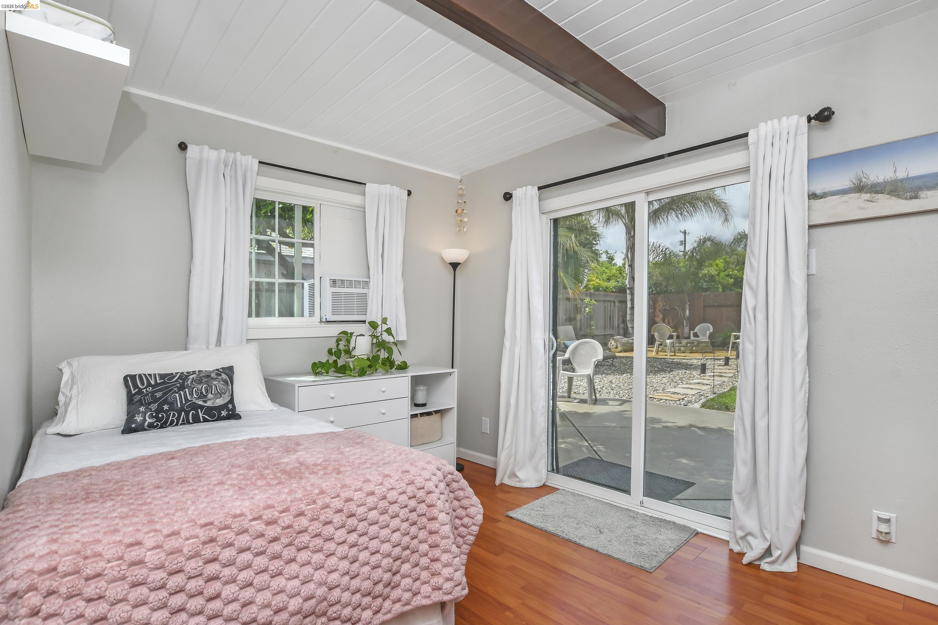 37 Beach Drive Bay Point, CA 94565 - Photo 17 of 33 a bedroom with a bed and wooden floor