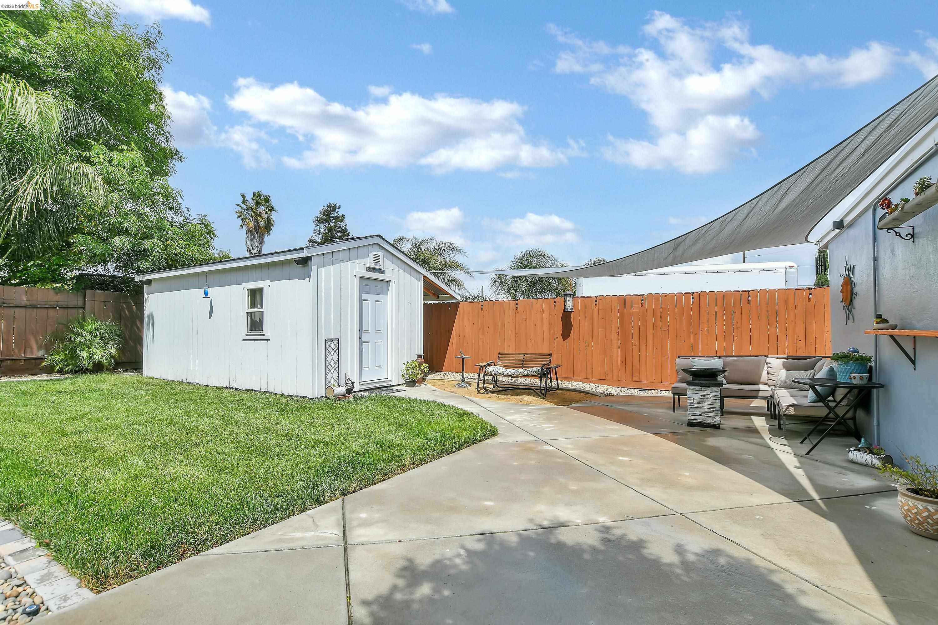 37 Beach Drive Bay Point, CA 94565 - Photo 20 of 33 a backyard of a house with table and chairs