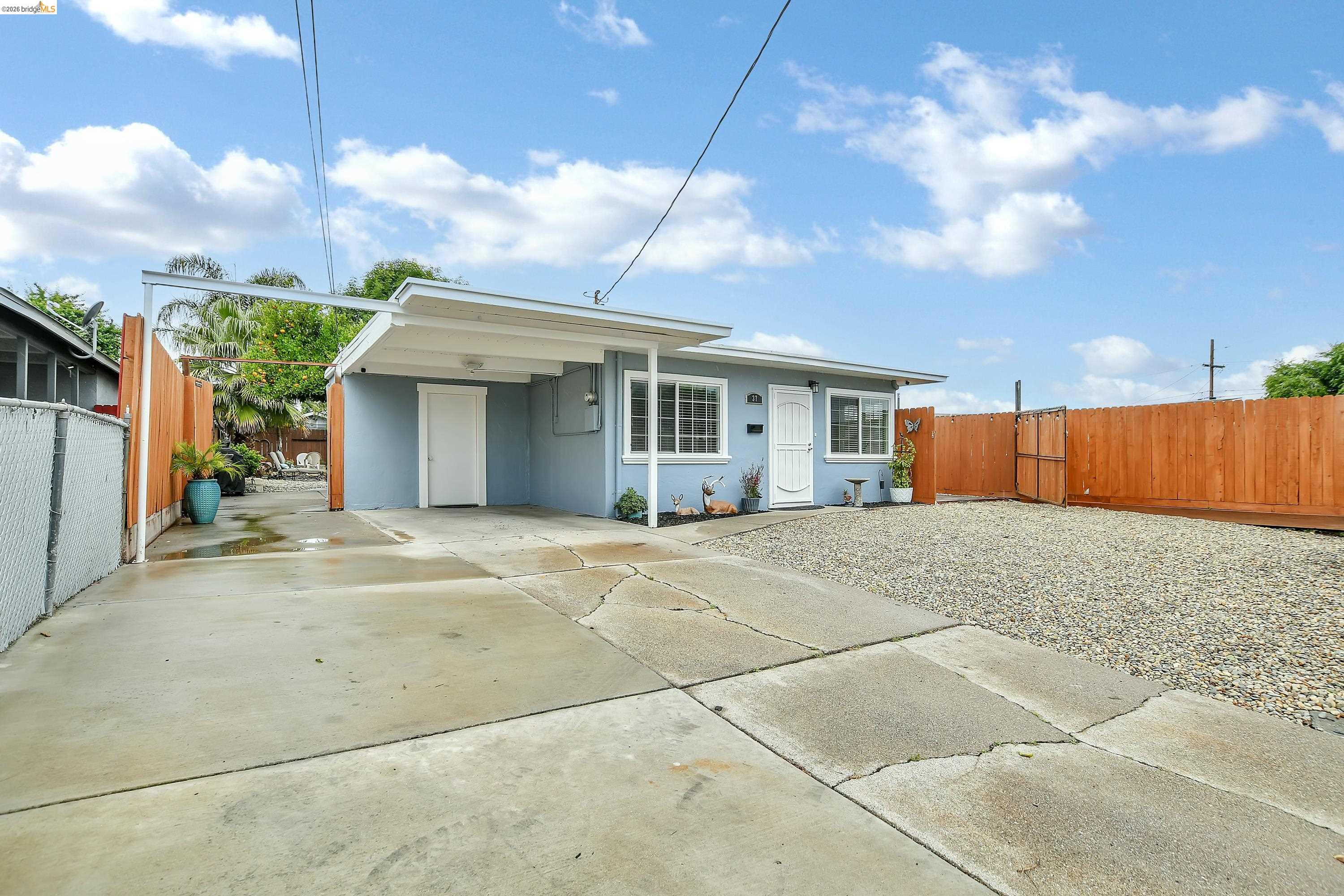 37 Beach Drive Bay Point, CA 94565 - Photo 33 of 33 a view of a white house with a yard