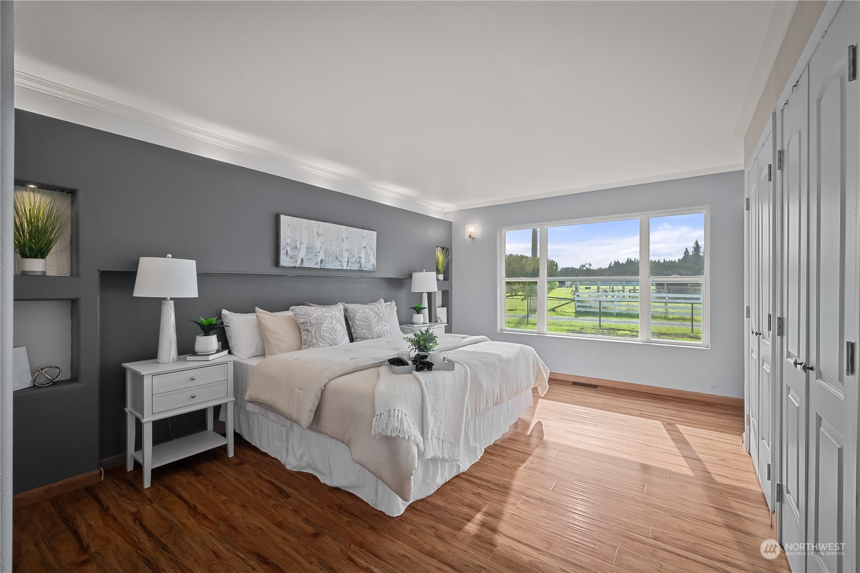 10121 Meadowside Lane Southwest Rochester, WA 98579 - Photo 18 of 35 a bed room with a bed and a large window