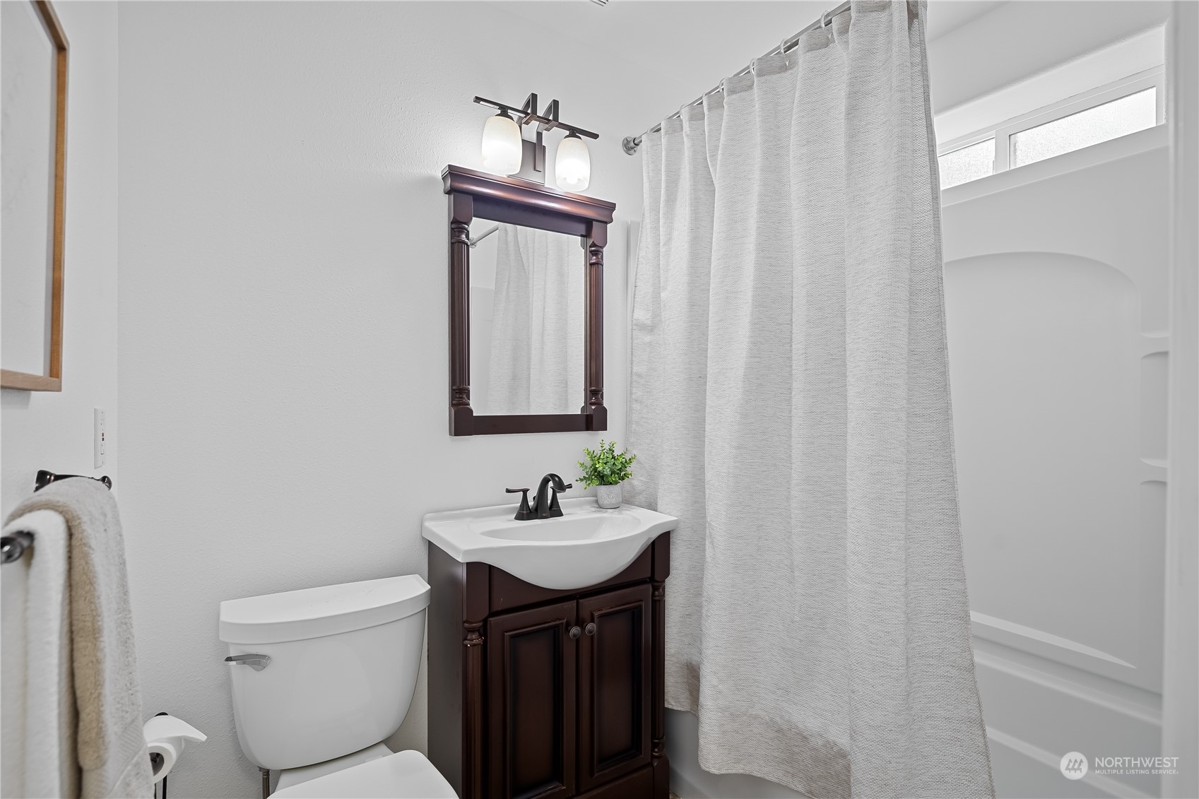 10121 Meadowside Lane Southwest Rochester, WA 98579 - Photo 24 of 35 a bathroom with a sink toilet and shower