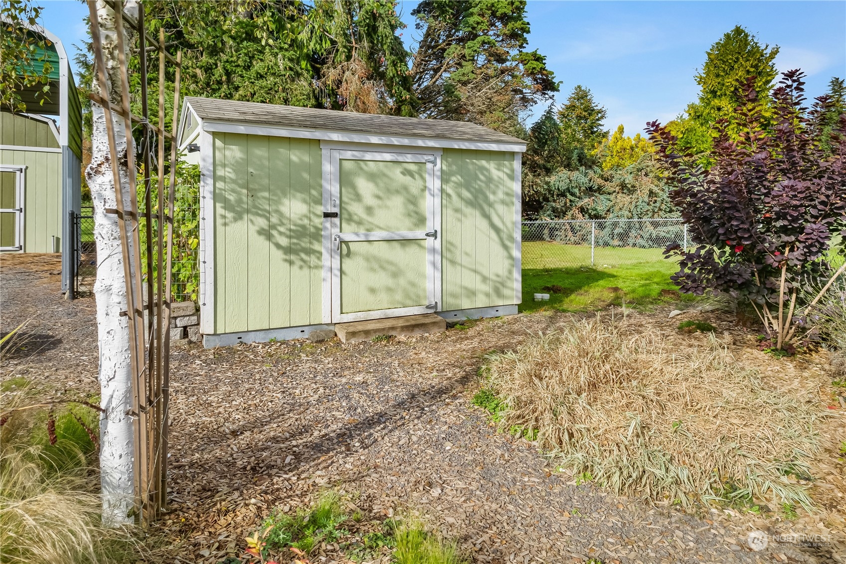 10121 Meadowside Lane Southwest Rochester, WA 98579 - Photo 30 of 35 a view of a backyard of the house