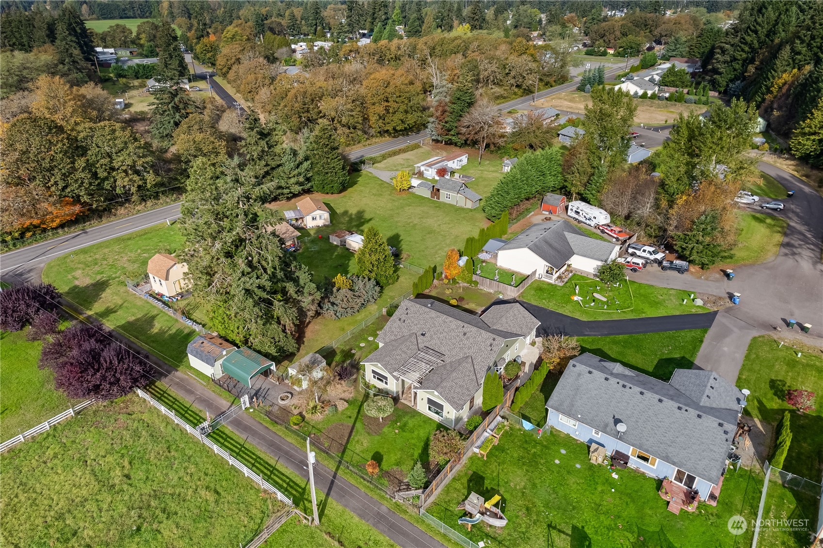 10121 Meadowside Lane Southwest Rochester, WA 98579 - Photo 33 of 35 an aerial view of a swimming pool patio and yard