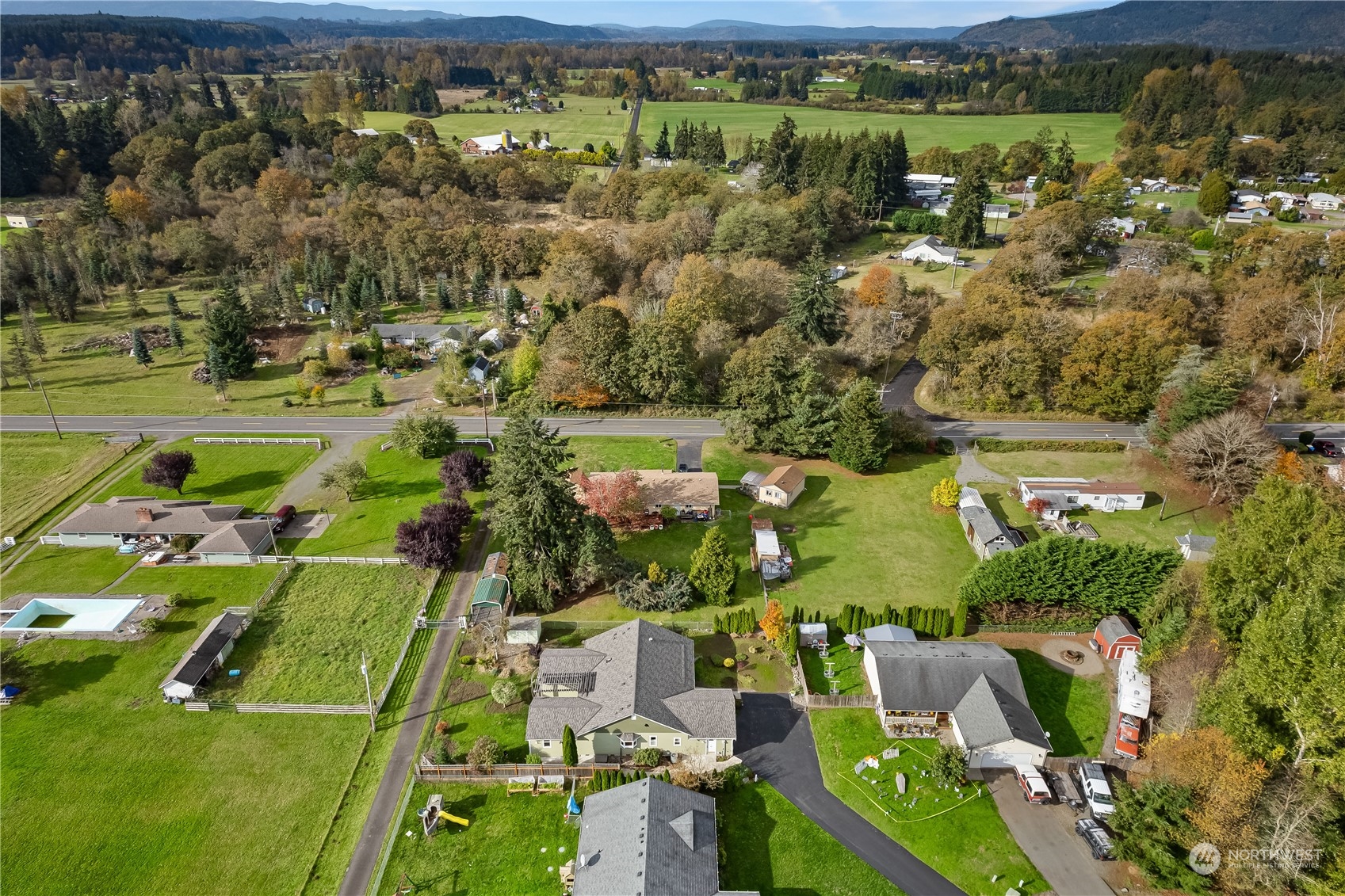 10121 Meadowside Lane Southwest Rochester, WA 98579 - Photo 34 of 35 an aerial view of residential houses with outdoor space and parking